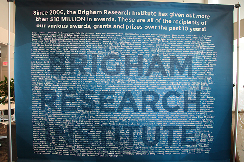 A large banner displaying the names of all award recipients from the BRI over the first ten years of the organization.